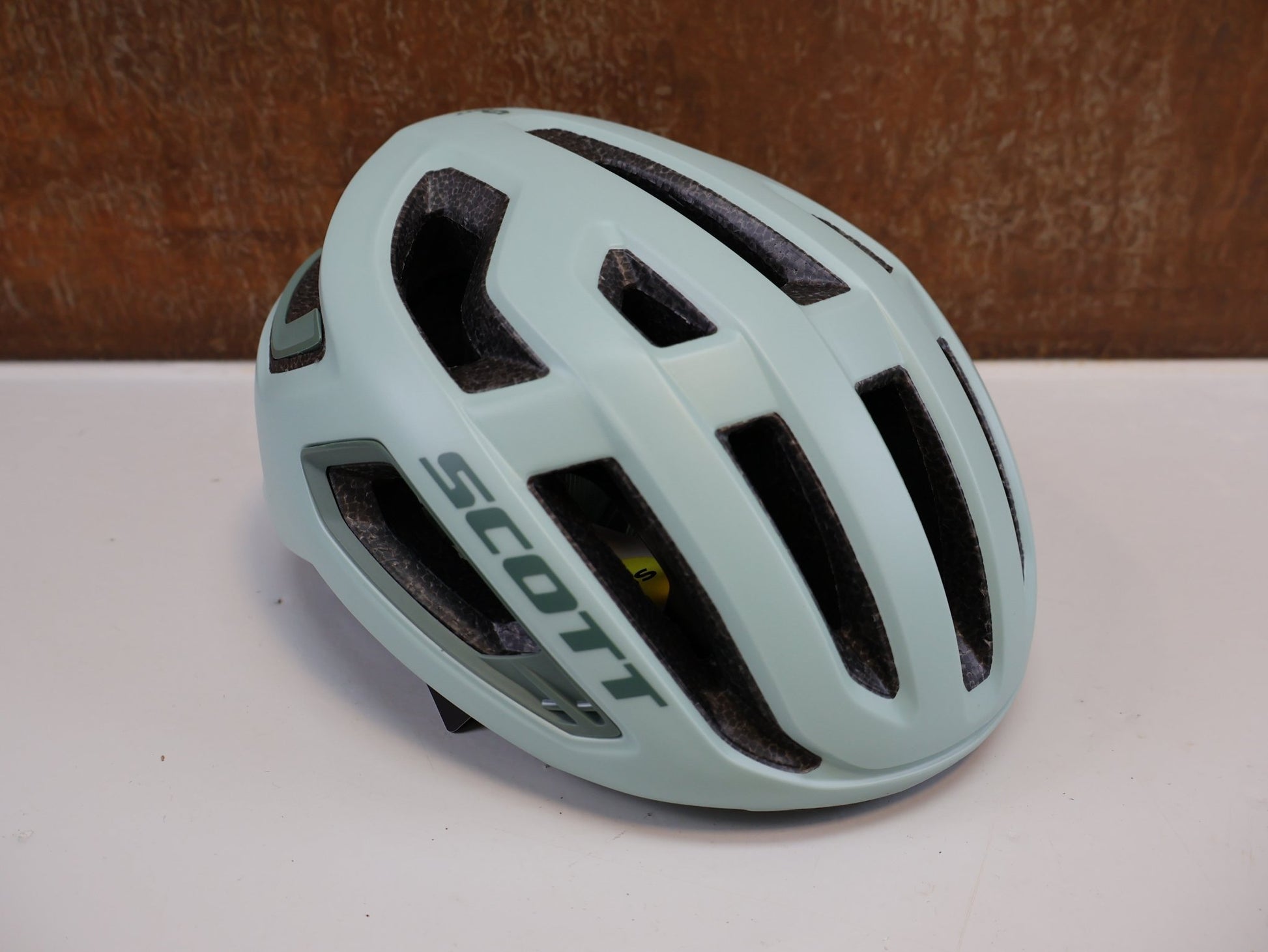 Helme von Scott, SCOTT ARX PLUS MIPS HELM / MINERAL GREEN / GR. M (55 - 59CM) / ROAD & MTB vor USEDBIKES - OB.DE Hintergrund