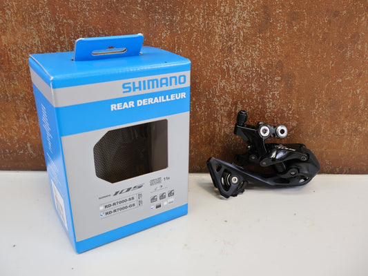 Schaltungsteile von Shimano, SHIMANO 105 SCHALTWERK RD-R7000-GS / 2X11-FACH / MITTELLANG BIS 34Z vor USEDBIKES-OB.DE Hintergrund