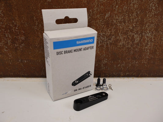 Bremsadapter von Shimano, SHIMANO ADAPTER SM-MA-R160D/D / FLATMOUNT RAHMEN AUF FLATMOUNT SATTEL / HR 160 MM vor USEDBIKES-OB.DE Hintergrund