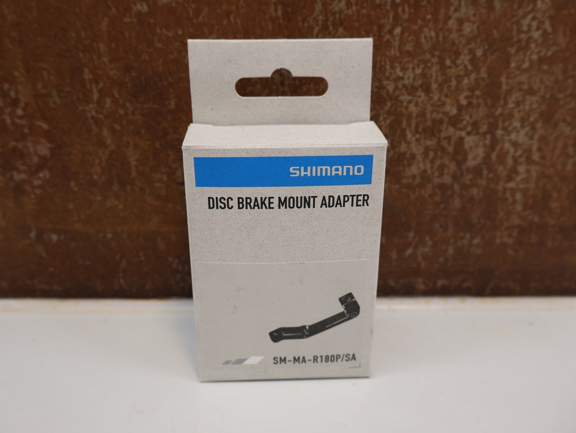 Bremsadapter von Shimano, SHIMANO ADAPTER SM-MA-R180P/S / IS 2000 RAHMEN AUF PM BREMSSATTEL / HR 180 MM vor USEDBIKES-OB.DE Hintergrund