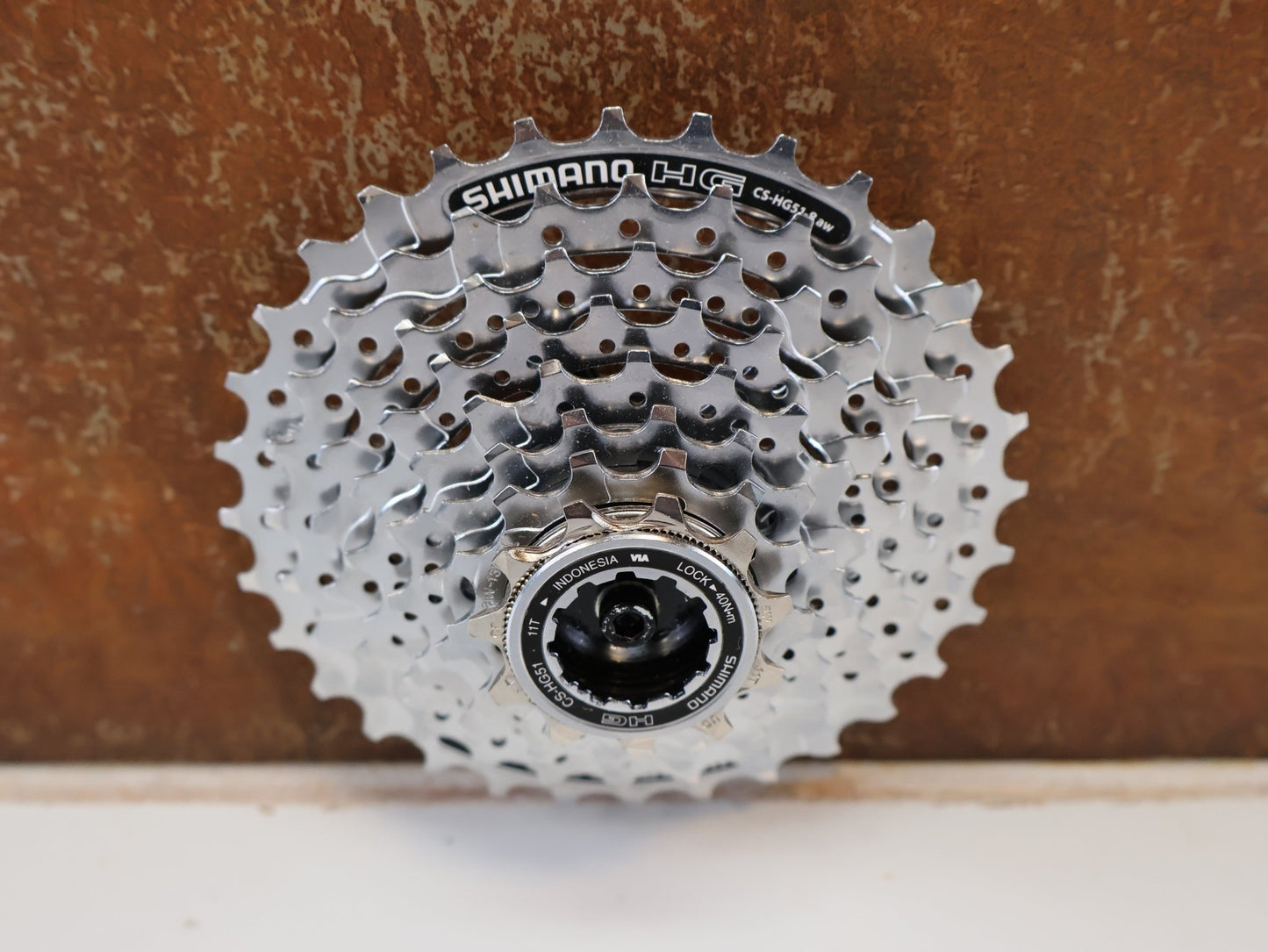 Kassette & Zahnkränze von Shimano, SHIMANO CS-HG51-8 KASSETTE / 8-FACH ALIVIO MTB TREKKING HYPERGLIDE vor USEDBIKES-OB.DE Hintergrund