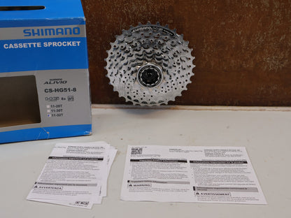 Kassette & Zahnkränze von Shimano, SHIMANO CS-HG51-8 KASSETTE / 8-FACH ALIVIO MTB TREKKING HYPERGLIDE vor USEDBIKES-OB.DE Hintergrund
