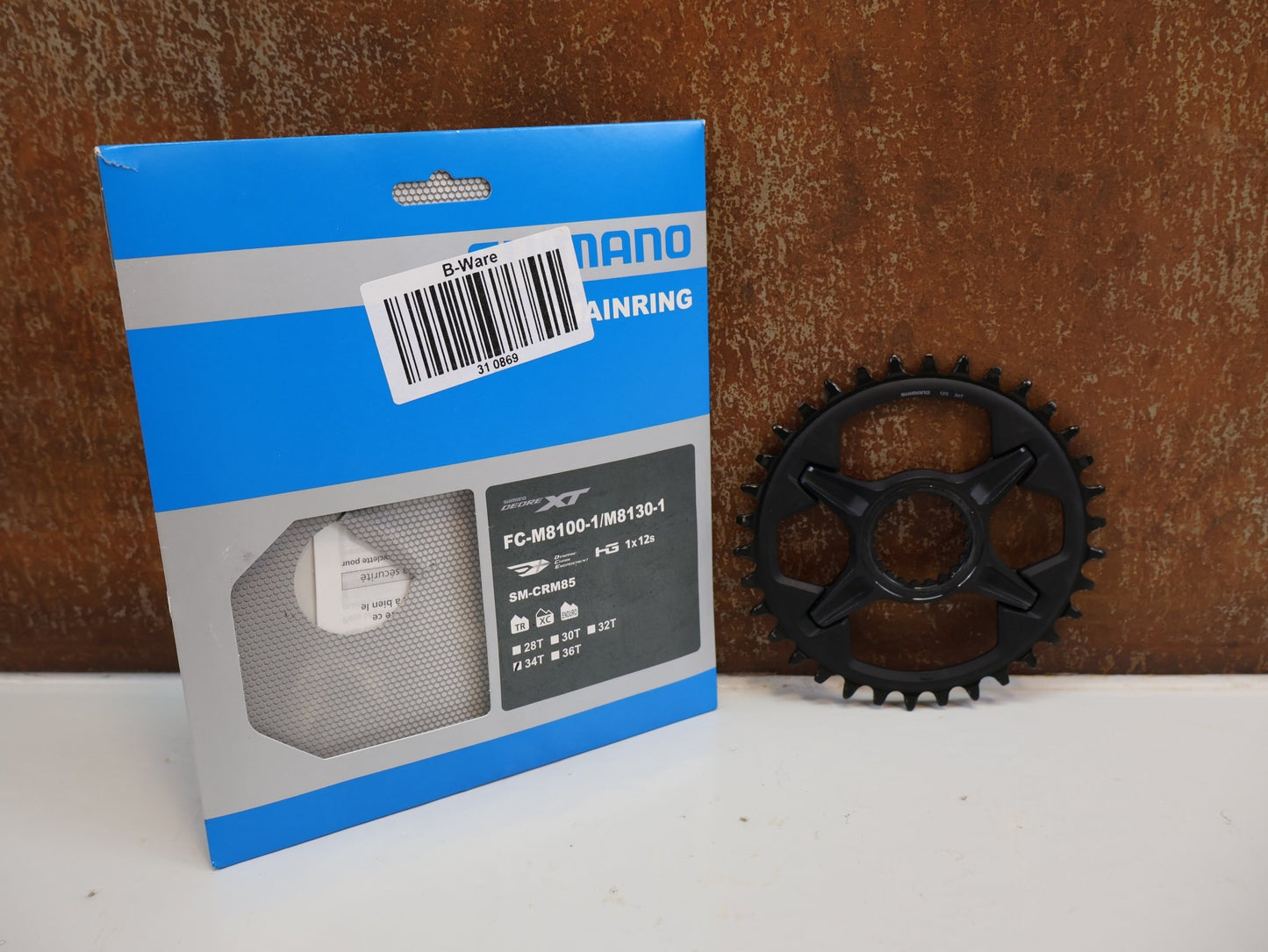 Kettenblatt von Shimano, SHIMANO DEORE XT KETTENBLATT SM-CRM85 / 34 ZÄHNE / 1X12-FACH / DIRECT MOUNT / FC-M8100-1/ M8130-1 vor USEDBIKES-OB.DE Hintergrund