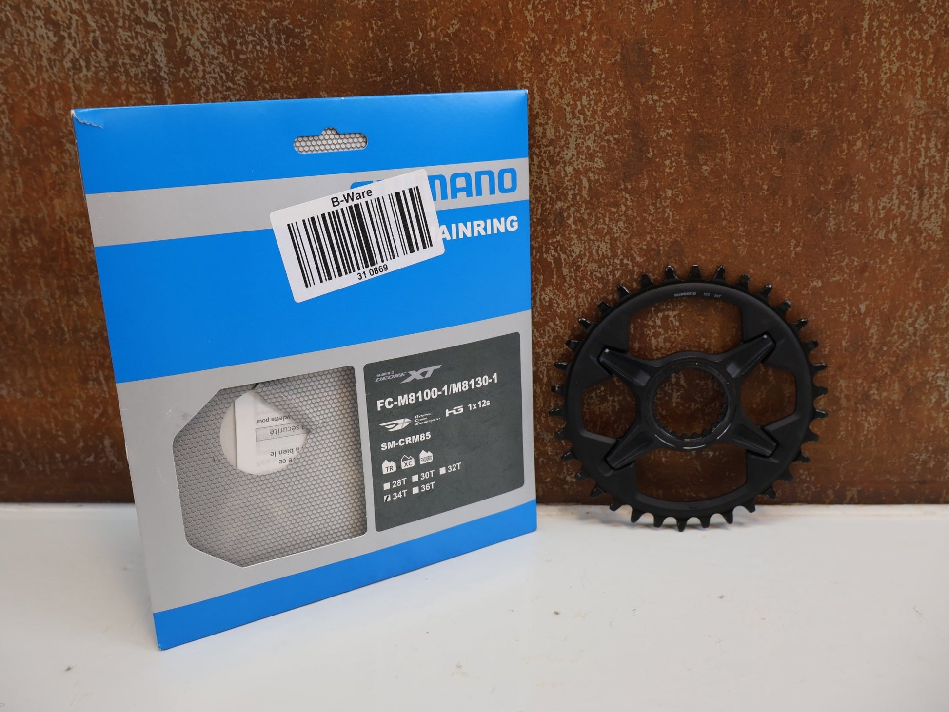Kettenblatt von Shimano, SHIMANO DEORE XT KETTENBLATT SM-CRM85 / 34 ZÄHNE / 1X12-FACH / DIRECT MOUNT / FC-M8100-1/ M8130-1 vor USEDBIKES-OB.DE Hintergrund