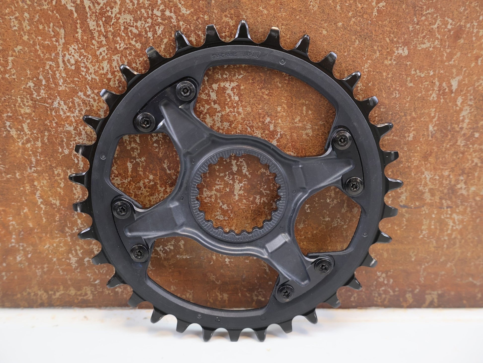 Kettenblatt von Shimano, SHIMANO DEORE XT KETTENBLATT SM-CRM85 / 34 ZÄHNE / 1X12-FACH / DIRECT MOUNT / FC-M8100-1/ M8130-1 vor USEDBIKES-OB.DE Hintergrund