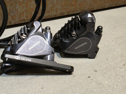Schaltgruppen von Shimano, SHIMANO DURA ACE DI2 9070 SCHALTGRUPPE FD / RD / SHIFTER / DISC 2 X 11 FACH in variant_title vor USEDBIKES - OB.DE Hintergrund
