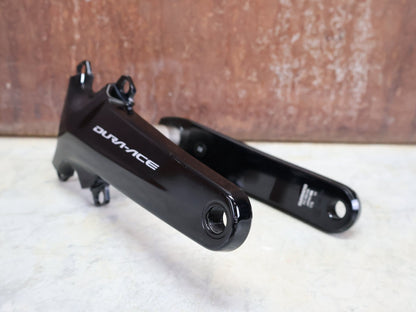 Kurbel von Shimano, SHIMANO DURA ACE FC - R9100 KURBELARME 2X11 FACH 175MM vor USEDBIKES - OB.DE Hintergrund