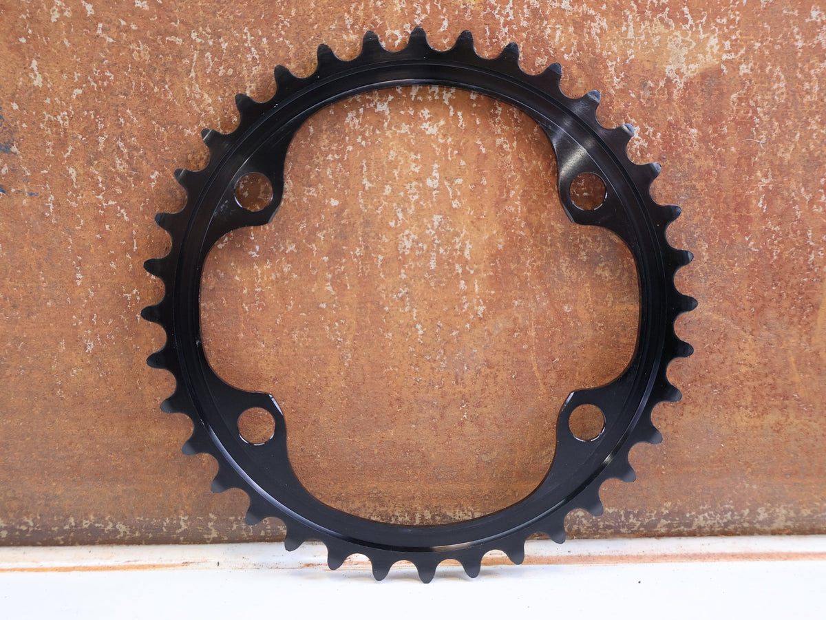 Kettenblatt von Shimano, Shimano Dura-Ace FC-R9200 Kettenblatt 36Z NH 12-fach Road vor USEDBIKES-OB.DE Hintergrund