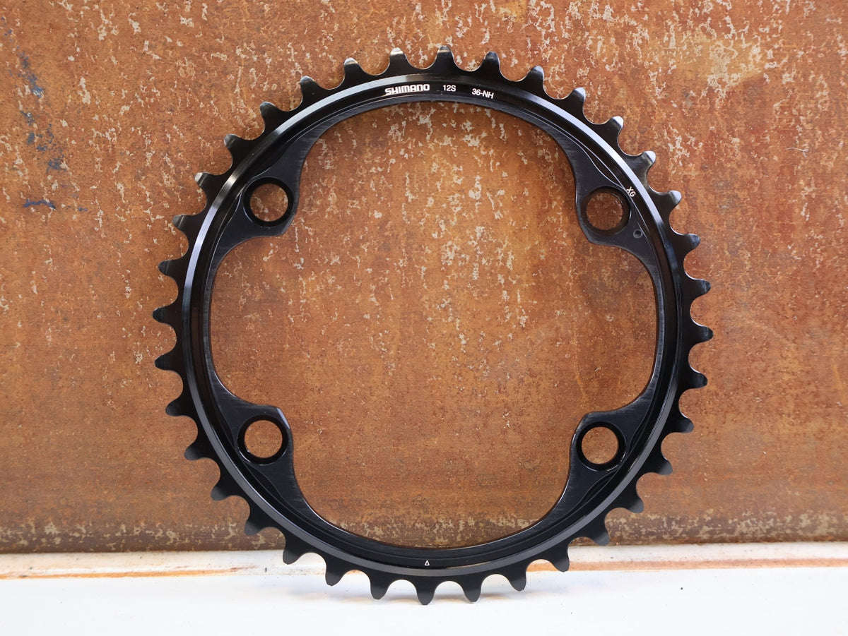 Kettenblatt von Shimano, Shimano Dura-Ace FC-R9200 Kettenblatt 36Z NH 12-fach Road vor USEDBIKES-OB.DE Hintergrund