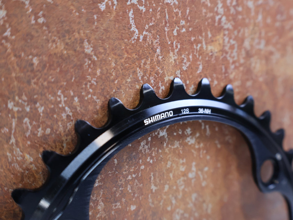 Kettenblatt von Shimano, Shimano Dura-Ace FC-R9200 Kettenblatt 36Z NH 12-fach Road vor USEDBIKES-OB.DE Hintergrund