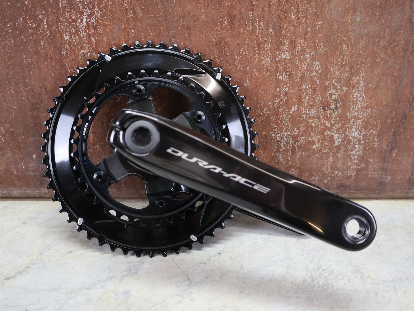 Kurbel von Shimano, SHIMANO DURA ACE FC - R9200 KURBELGARNITUR 2X11 FACH 52/36 ZÄHNE 172.5MM vor USEDBIKES - OB.DE Hintergrund