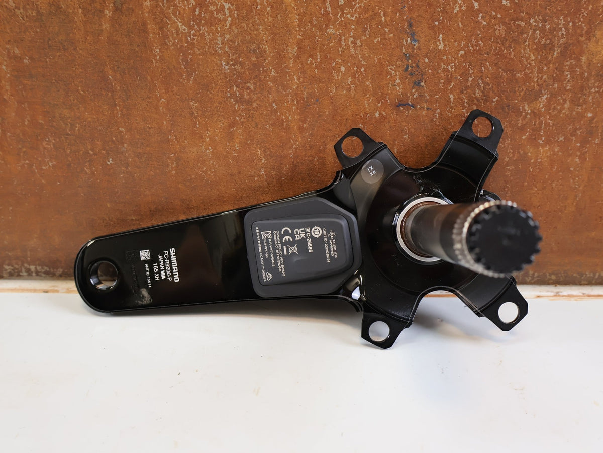 Powermeter von Shimano, Shimano Dura-Ace FC-R9200-P Powermeter Kurbel 165mm Road vor USEDBIKES-OB.DE Hintergrund