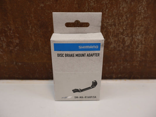 Bremsadapter von Shimano, SHIMANO HR BREMSSCHEIBEN ADAPTER SM-MA-R160P/S / IS 2000 vor USEDBIKES-OB.DE Hintergrund