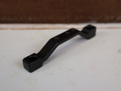 Zubehör von Shimano, SHIMANO POSTMOUNT ADAPTER PM 203 AUF 220 MM SM-MA-F220P/PL vor USEDBIKES-OB.DE Hintergrund