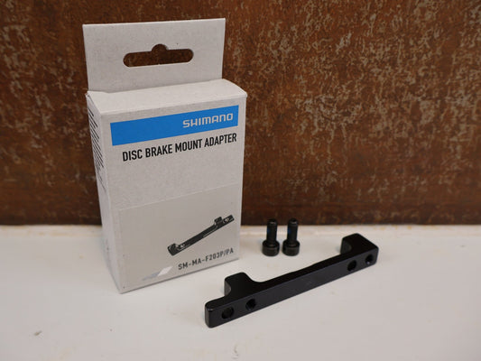 Bremsadapter von Shimano, SHIMANO SCHEIBENBREMS ADAPTER SM-MA-F203P/PA vor USEDBIKES-OB.DE Hintergrund