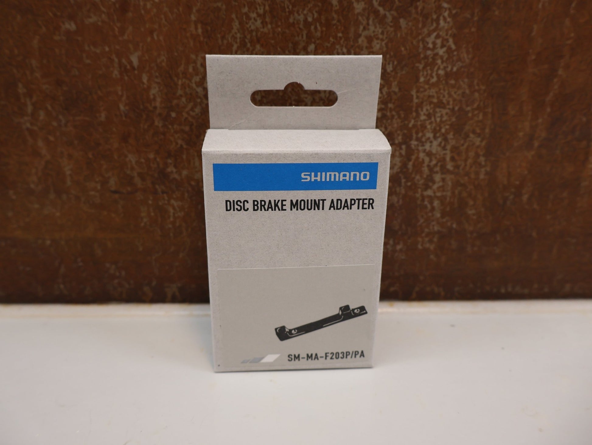 Bremsadapter von Shimano, SHIMANO SCHEIBENBREMS ADAPTER SM-MA-F203P/PA vor USEDBIKES-OB.DE Hintergrund