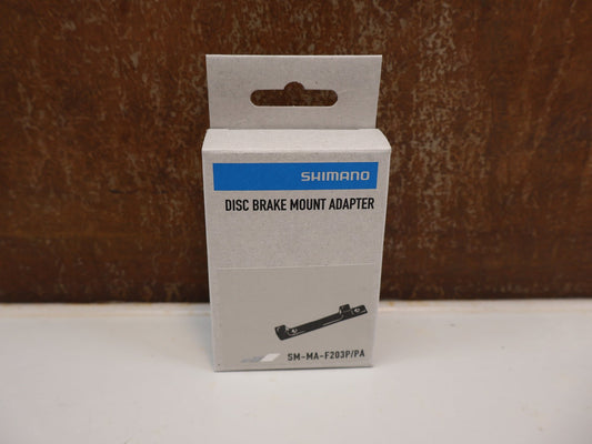 Bremsadapter von Shimano, SHIMANO SCHEIBENBREMS ADAPTER SM-MA-F203P/PA vor USEDBIKES-OB.DE Hintergrund