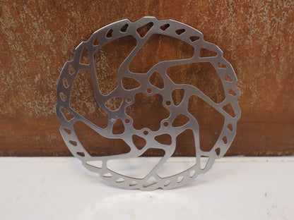 Bremsscheibe von Shimano, SHIMANO SLX SM RT66 BREMSSCHEIBE 180MM 6 LOCH vor USEDBIKES-OB.DE Hintergrund