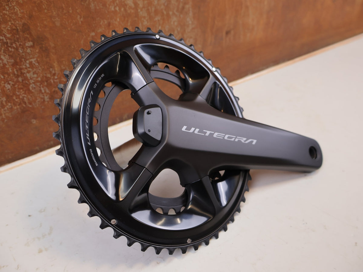 Kurbel von Shimano, Shimano Ultegra FC-R8100-P Powermeter Kurbel 170mm 50-34Z vor USEDBIKES-OB.DE Hintergrund