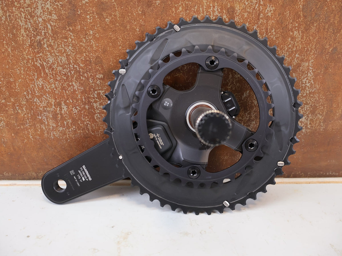 Kurbel von Shimano, Shimano Ultegra FC-R8100-P Powermeter Kurbel 170mm 50-34Z vor USEDBIKES-OB.DE Hintergrund