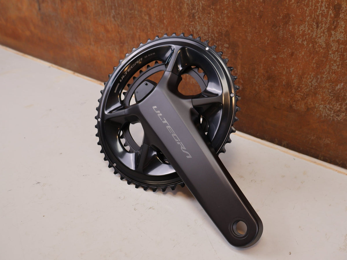 Kurbel von Shimano, Shimano Ultegra FC-R8100-P Powermeter Kurbel 172.5mm 50-34Z vor USEDBIKES-OB.DE Hintergrund