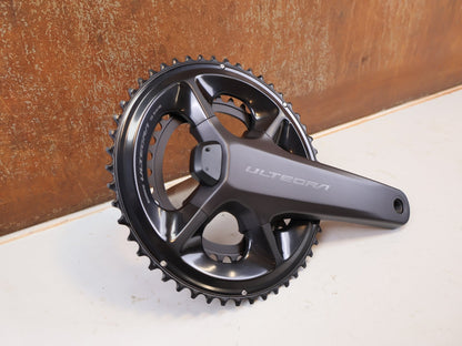 Kurbel von Shimano, Shimano Ultegra FC-R8100-P Powermeter Kurbel 172.5mm 50-34Z vor USEDBIKES-OB.DE Hintergrund