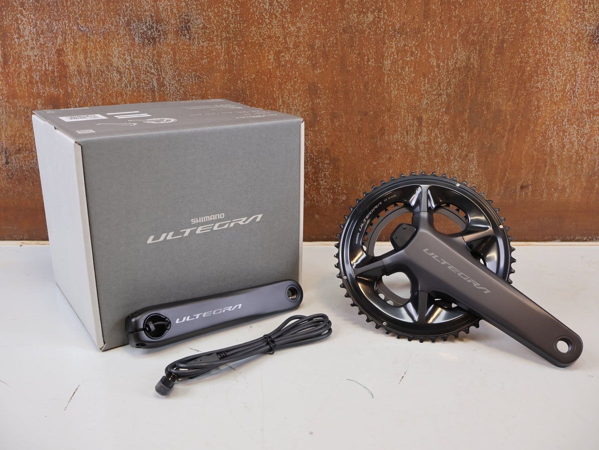 Kurbel von Shimano, Shimano Ultegra FC-R8100-P Powermeter Kurbel 172.5mm 50-34Z vor USEDBIKES-OB.DE Hintergrund