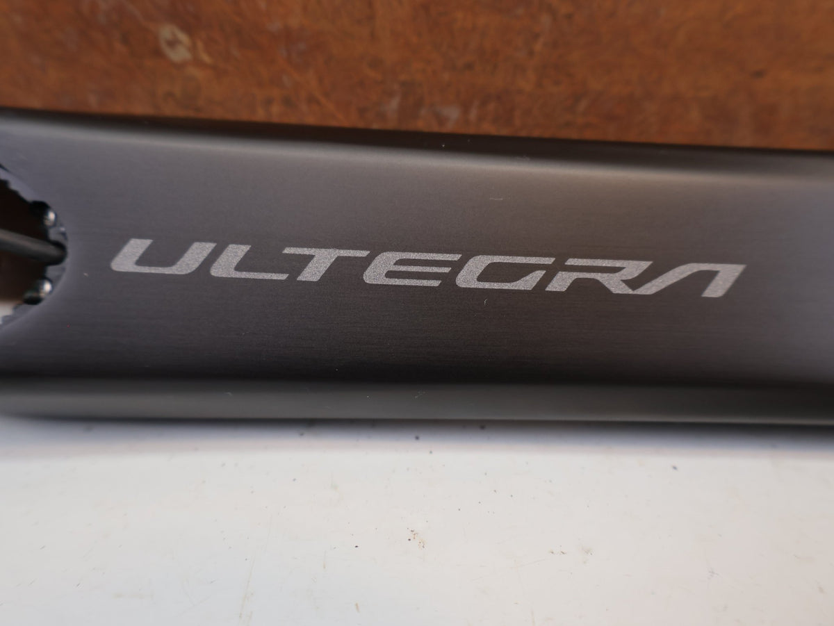 Kurbel von Shimano, Shimano Ultegra FC-R8100-P Powermeter Kurbel 172.5mm 50-34Z vor USEDBIKES-OB.DE Hintergrund