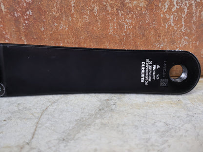 Kurbel von Shimano, SHIMANO XTR FC - M9100 - 1 KURBEL – 1 - FACH / 175 MM / HOLLOWTECH II – OHNE KETTENBLATT vor USEDBIKES - OB.DE Hintergrund