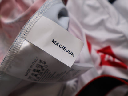 Anzug - BOH von Specialized, SPECIALIZED RED BULL - BORA HANSGROHE AERO SKIN SUIT LS / POLAND CHAMPION vor USEDBIKES - OB.DE Hintergrund