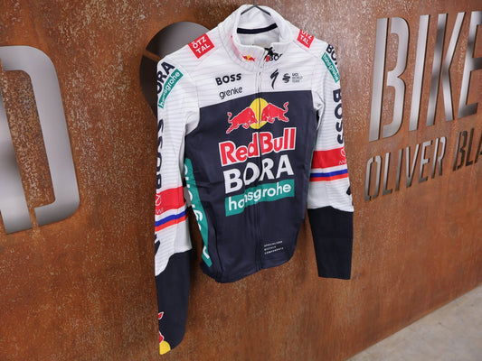 Langarm Trikot - BOH von Specialized, SPECIALIZED RED BULL - BORA HANSGROHE THERMAL JERSEY LS ROGLIČ / LANGARM TRIKOT vor USEDBIKES - OB.DE Hintergrund