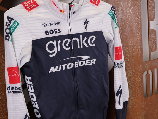 Langarm Trikot - BOH von Specialized, SPECIALIZED TGA ROOKIES OF RED BULL - BORA HANSGROHE THERMAL JERSEY LS / LANGARM TRIKOT vor USEDBIKES - OB.DE Hintergrund