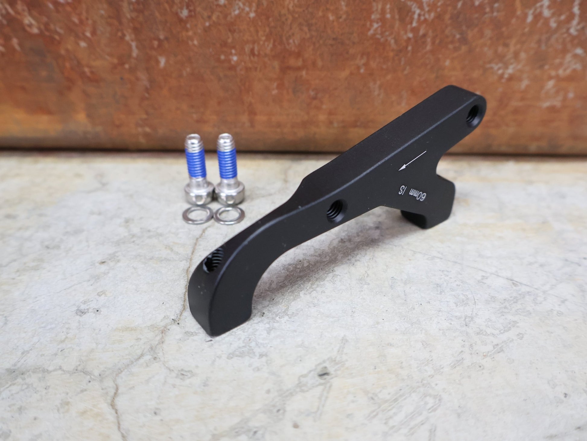 Zubehör von Sram, SRAM BREMSADAPTER IS AUF PM (RAHMEN) FÜR 200 MM ROTOR – 00.5318.009.004 vor USEDBIKES - OB.DE Hintergrund