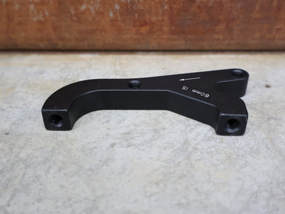 Zubehör von Sram, SRAM BREMSADAPTER IS AUF PM (RAHMEN) FÜR 200 MM ROTOR – 00.5318.009.004 vor USEDBIKES - OB.DE Hintergrund