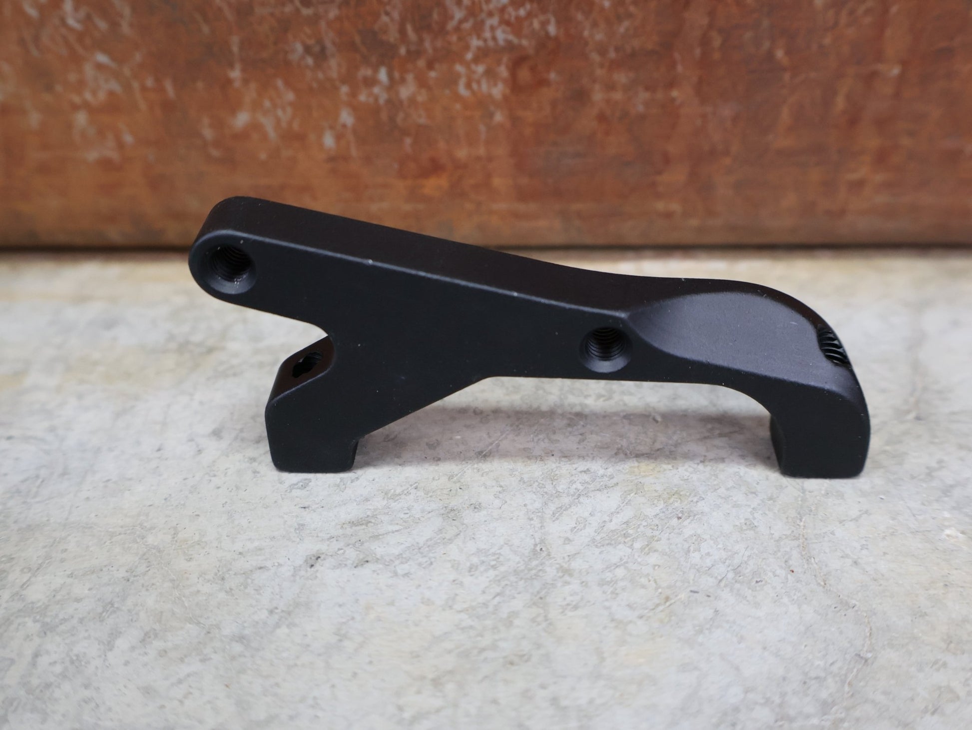 Zubehör von Sram, SRAM BREMSADAPTER IS AUF PM (RAHMEN) FÜR 200 MM ROTOR – 00.5318.009.004 vor USEDBIKES - OB.DE Hintergrund