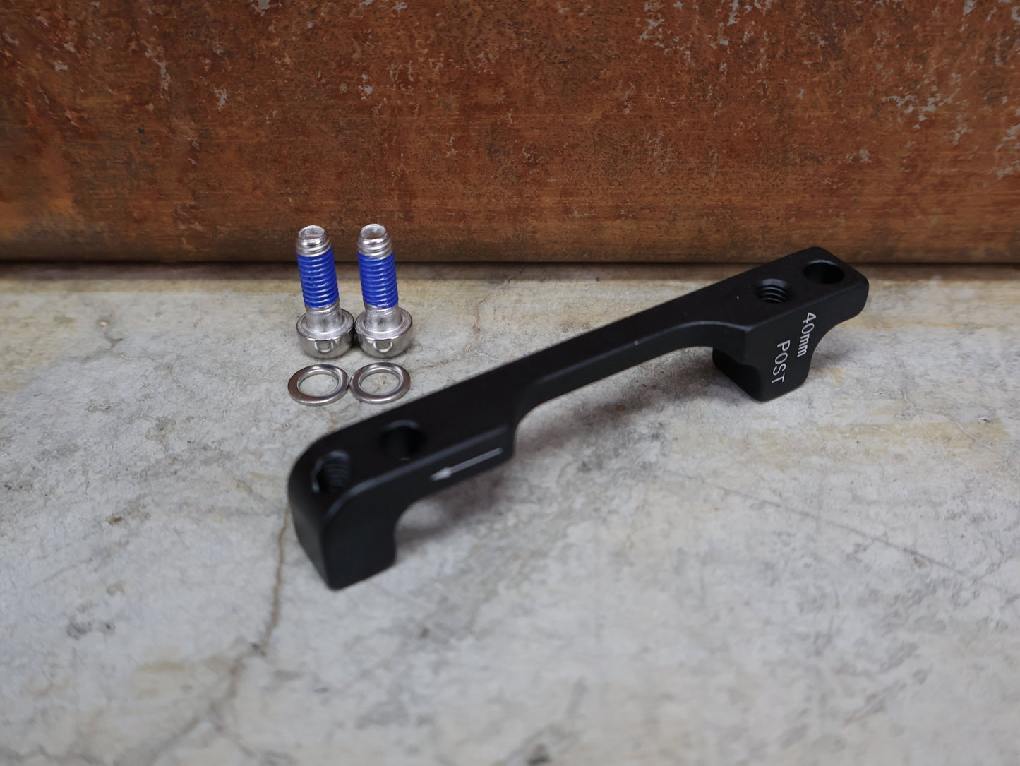 Zubehör von Sram, SRAM BREMSADAPTER PM 6" AUF PM – 40MM – 00.5318.007.003 vor USEDBIKES - OB.DE Hintergrund