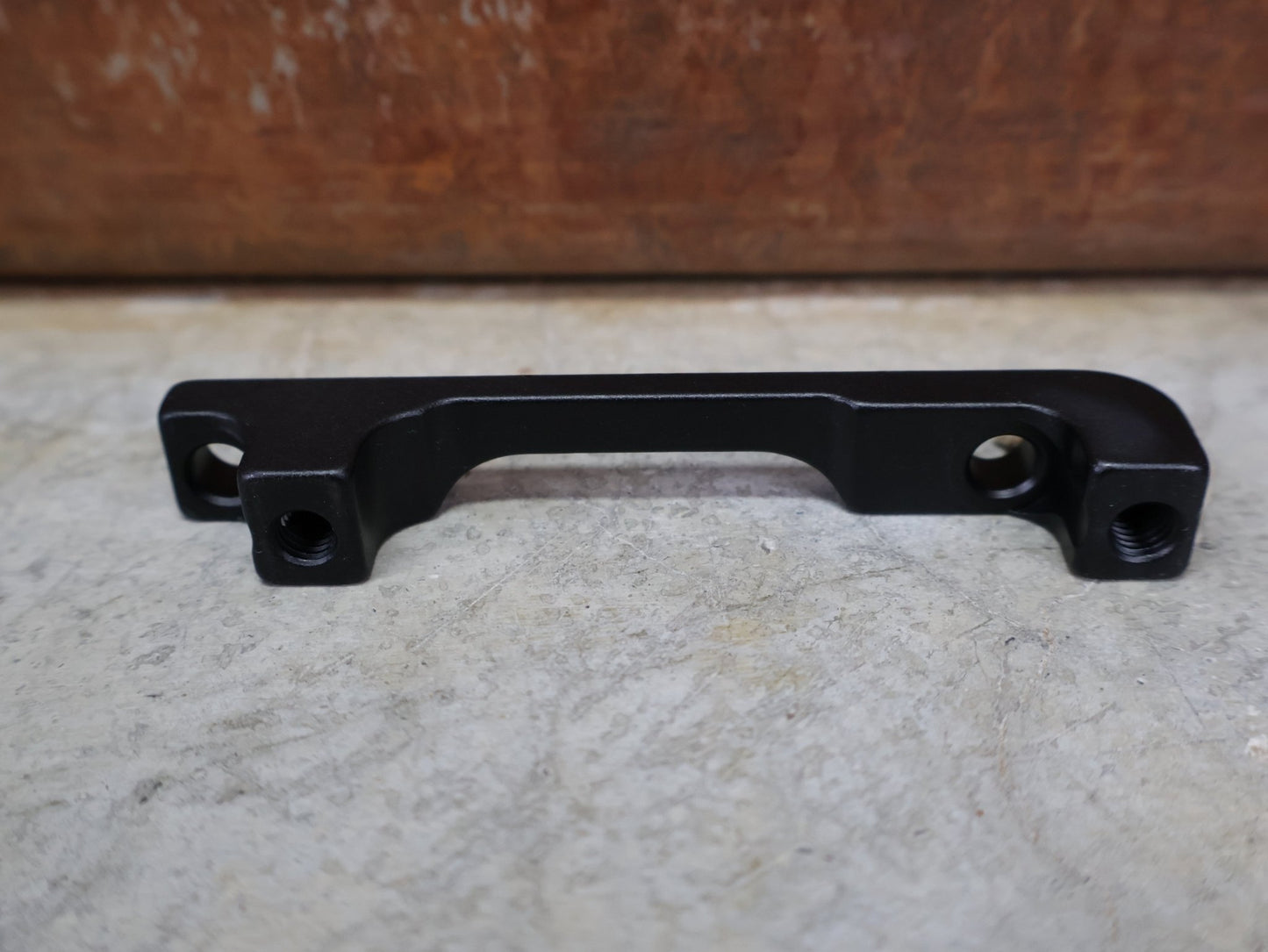 Zubehör von Sram, SRAM BREMSADAPTER PM 6" AUF PM – 40MM – 00.5318.007.003 vor USEDBIKES - OB.DE Hintergrund