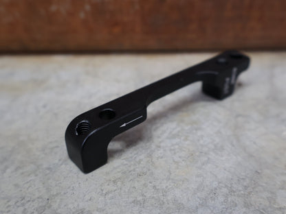 Zubehör von Sram, SRAM BREMSADAPTER PM 6" AUF PM – 40MM – 00.5318.007.003 vor USEDBIKES - OB.DE Hintergrund