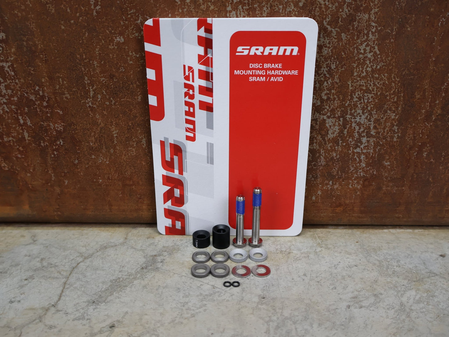 Zubehör von Sram, SRAM BREMSADAPTER PM XX 20 S TITAN – VR 180 MM / HR 160 MM – 00.5318.008.004 vor USEDBIKES - OB.DE Hintergrund