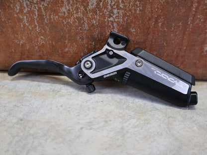 Bremse von Sram, SRAM CODE ULTIMATE STEALTH BREMSHEBEL – CARBON C1 BLACK vor USEDBIKES - OB.DE Hintergrund