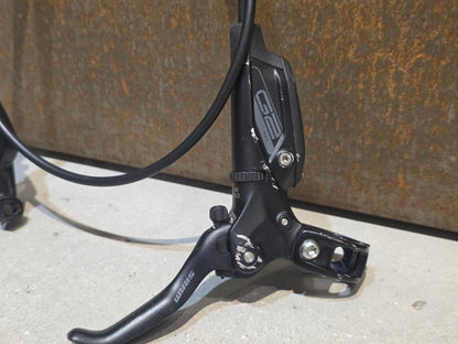 Bremse von Sram, SRAM G2 RSC 4 - KOLBEN BREMSE VORNE & HINTEN vor USEDBIKES - OB.DE Hintergrund