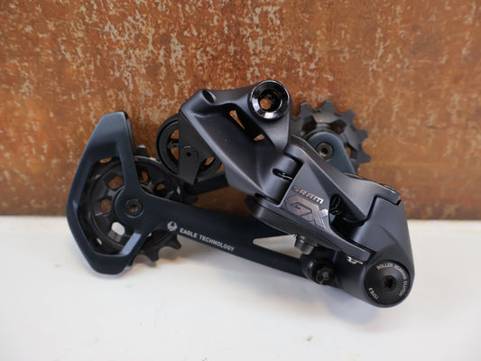 Schaltungsteile von Sram, SRAM GX EAGLE / 12-FACH MTB SCHALTWERK / TYPE 3.0 / LUNAR / 52 Z vor USEDBIKES-OB.DE Hintergrund