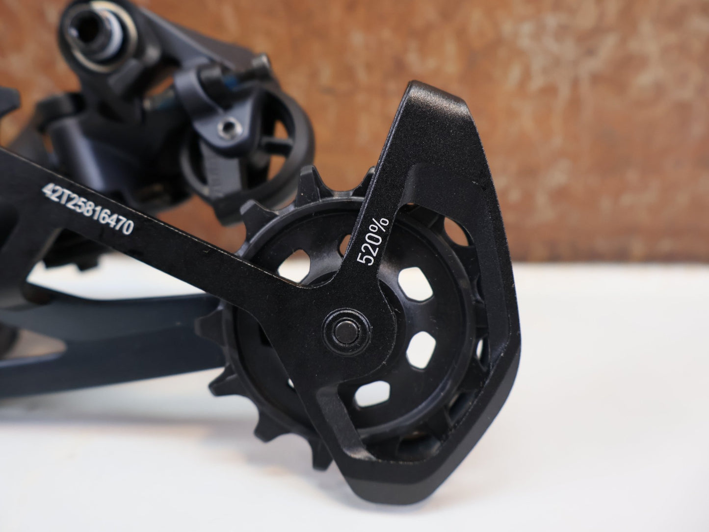 Schaltungsteile von Sram, SRAM GX EAGLE / 12-FACH MTB SCHALTWERK / TYPE 3.0 / LUNAR / 52 Z vor USEDBIKES-OB.DE Hintergrund