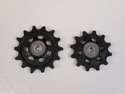 Schaltungsteile von Sram, SRAM GX EAGLE SCHALTRÖLLCHEN SET – 12-FACH ORIGINAL-ERSATZTEIL vor USEDBIKES-OB.DE Hintergrund