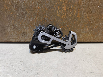Schaltungsteile von Sram, SRAM GX EAGLE SCHALTWERK 12 FACH / MAX. 50 ZÄHNE vor USEDBIKES - OB.DE Hintergrund