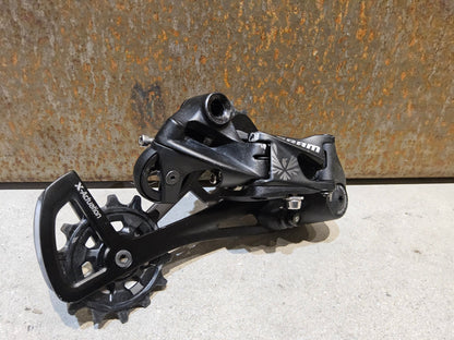 Schaltungsteile von Sram, SRAM GX EAGLE SCHALTWERK 12 FACH / MAX. 50 ZÄHNE vor USEDBIKES - OB.DE Hintergrund