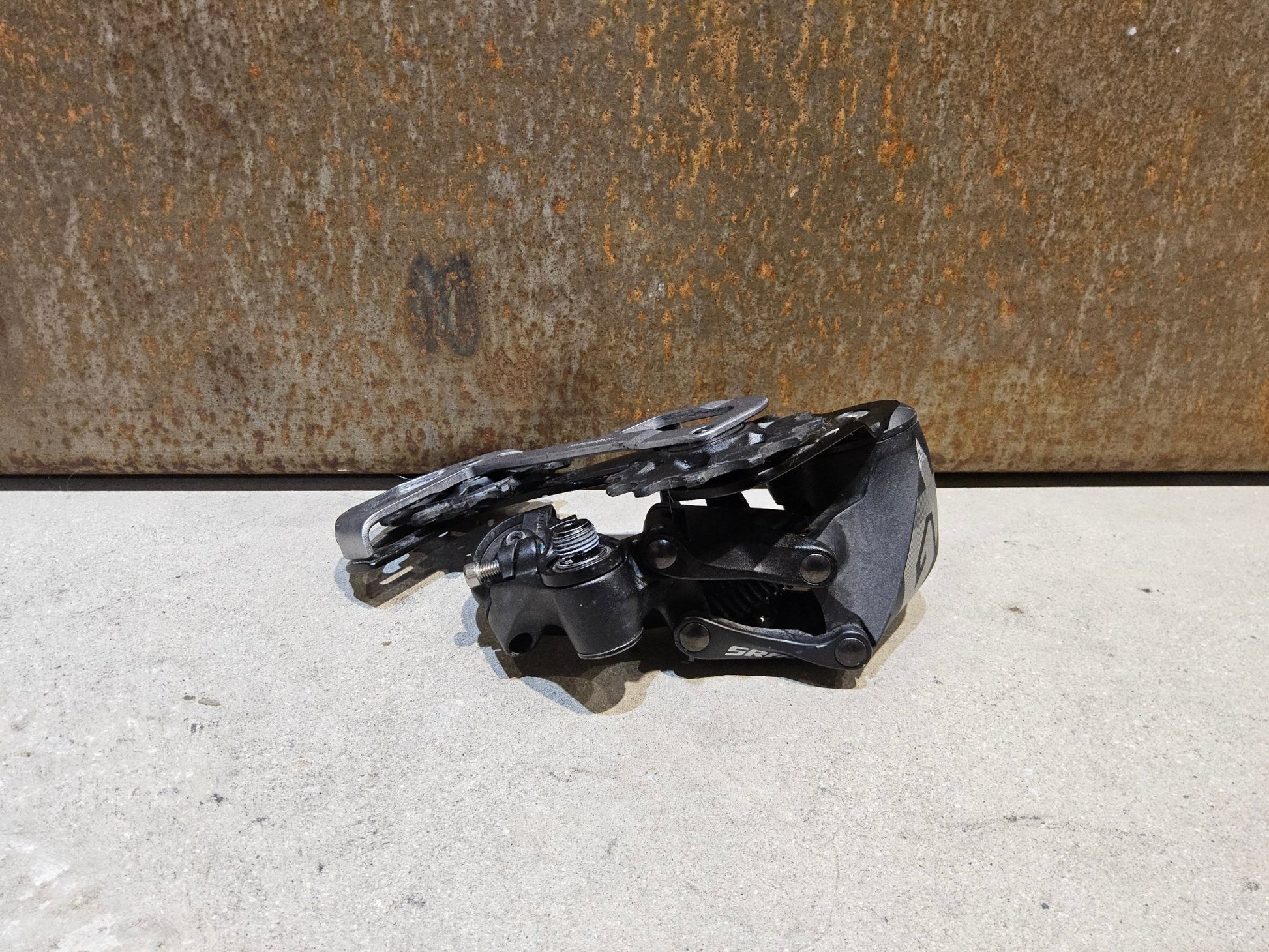 Schaltungsteile von Sram, SRAM GX EAGLE SCHALTWERK 12 FACH / MAX. 50 ZÄHNE vor USEDBIKES - OB.DE Hintergrund
