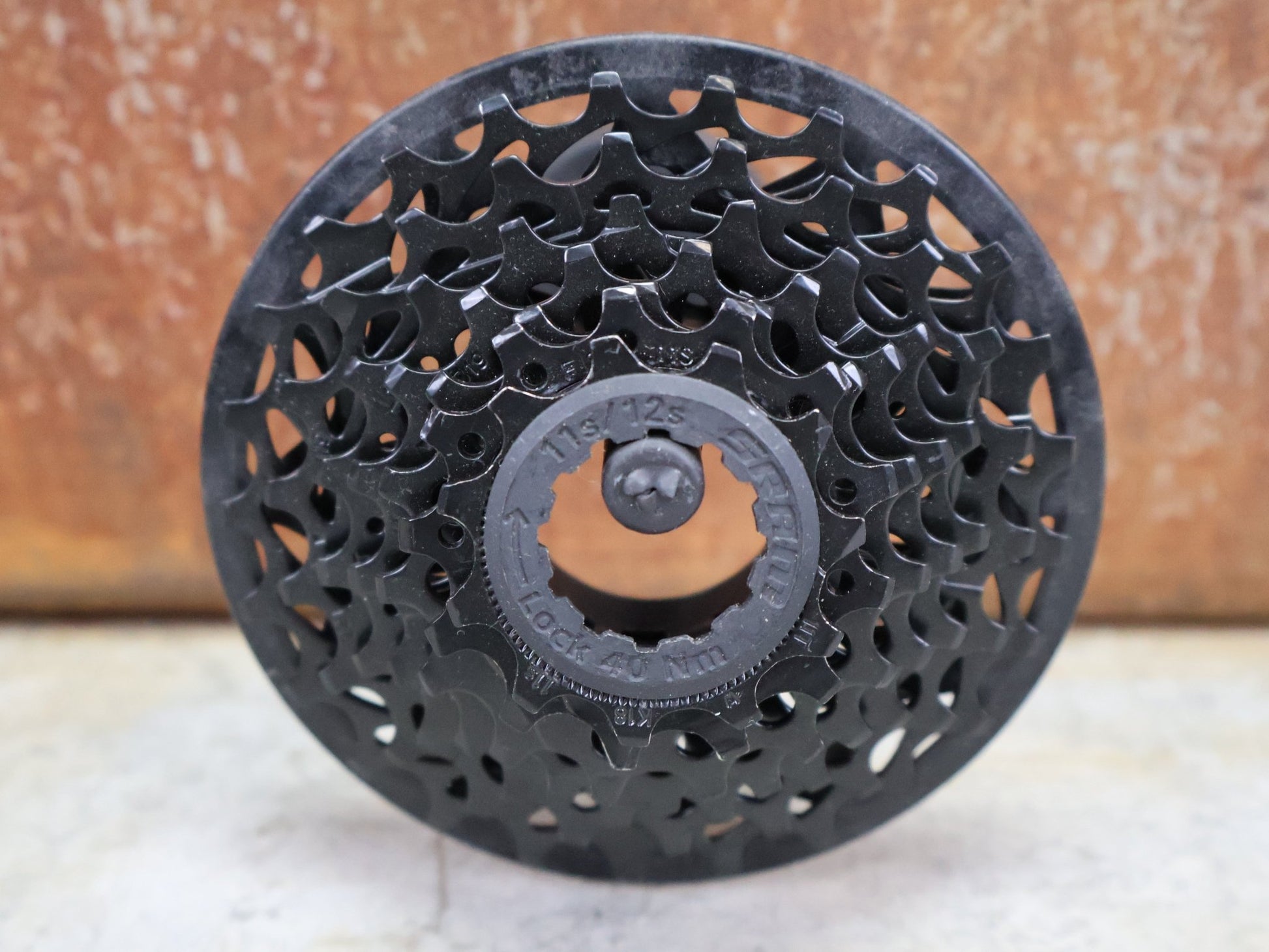 Kassette & Zahnkränze von Sram, SRAM GX1 DH PG - 720 KASSETTE 7 - FACH 11–25 ZÄHNE vor USEDBIKES - OB.DE Hintergrund