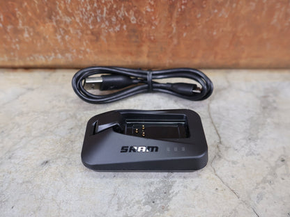 Zubehör von Sram, SRAM LADEGERÄT FÜR EAGLE / RED / FORCE / RIVAL / REVERB AXS & RED ETAP vor USEDBIKES - OB.DE Hintergrund