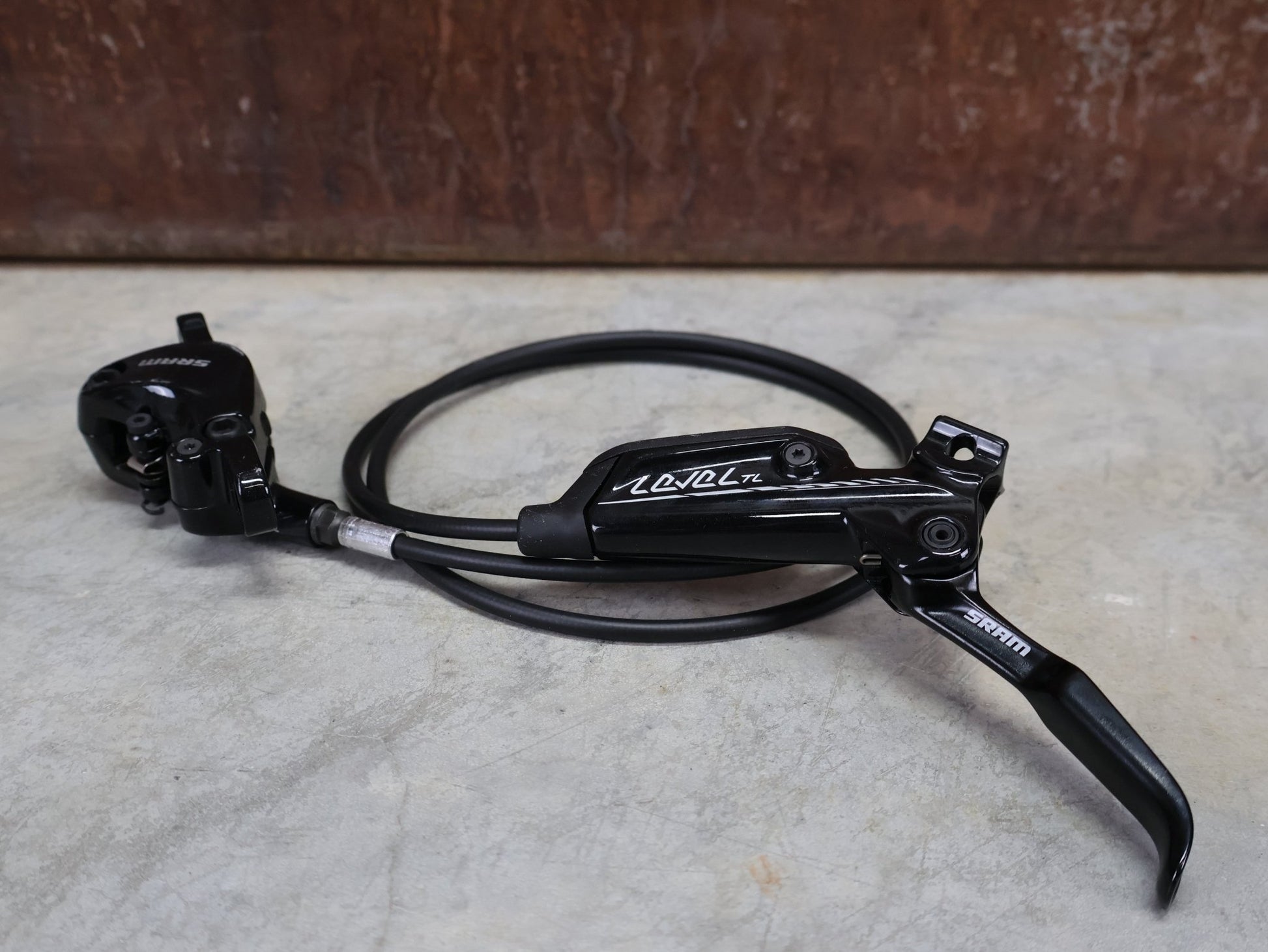 Bremse von Sram, SRAM LEVEL TL BREMSSET VORNE U. HINTEN SCHWARZ vor USEDBIKES - OB.DE Hintergrund